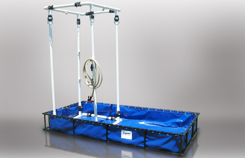 Husky Standard decon shower with handheld sprayer on a 4 x 8 ft catch pool